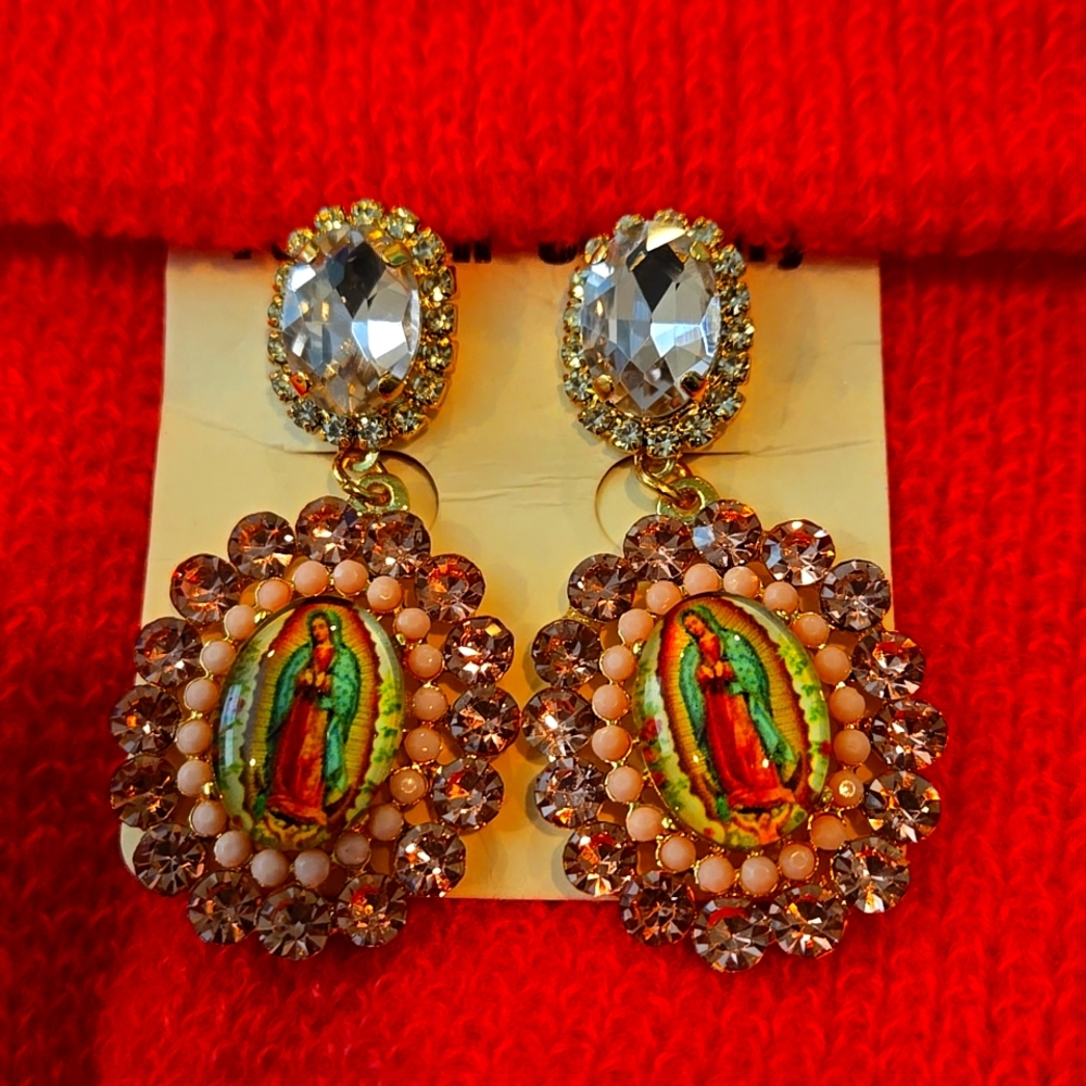 Dangle bejeweled earrings . Our blessed Mother conversation pieces